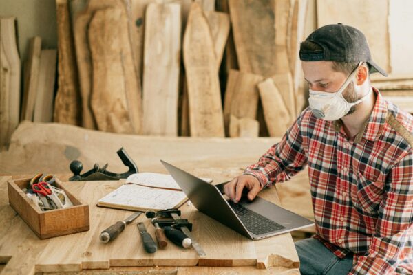 Woodworker reading our guide on installing wood stair balusters before he gets started.