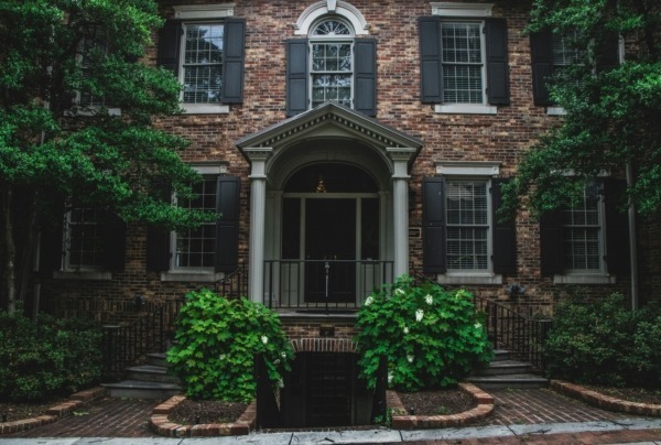 Outdoor wood structural columns in front of a home.