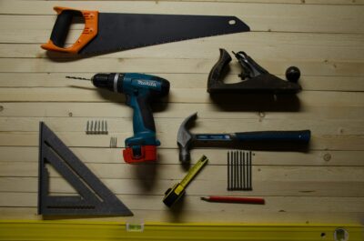 A variety of tools helpful for installing wood stair balusters.