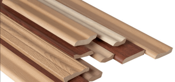 Various pieces of wood moulding in different lengths and finishes.