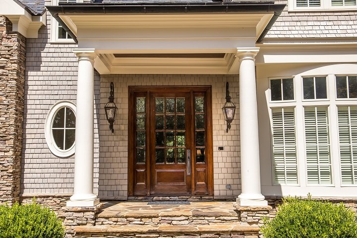 Sapele wood columns in front of a home.