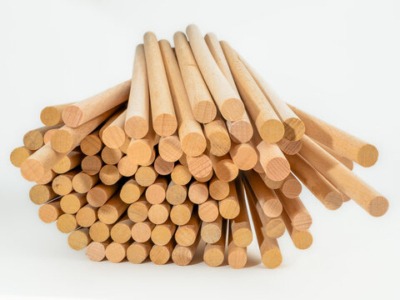 A bundle of wood dowels available when sourcing wholesale wood products.