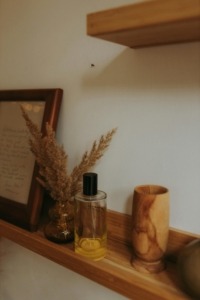 Floating wood shelves in a home for various items.